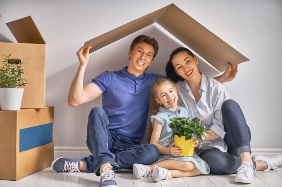 family using cardboard as housing